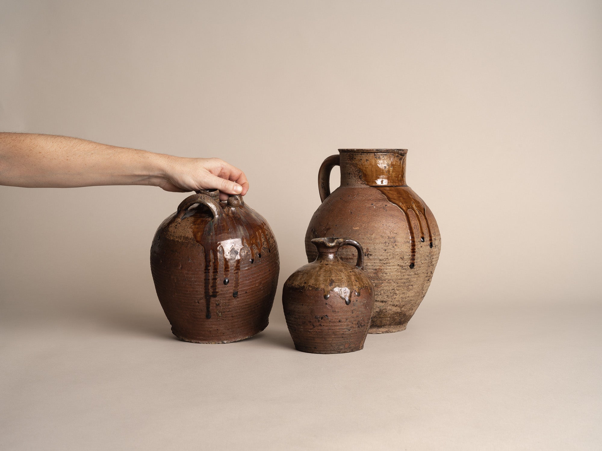 Ensemble de pots en grès de Puisaye, France (XVIIIe et XIXe siècles)..Set of stoneware folk pots by anonymous Puisaye potters, France (18th & 19th century)